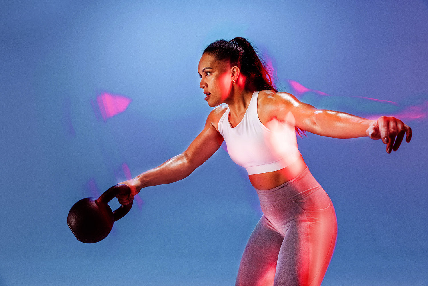 Woman using kettle bell
